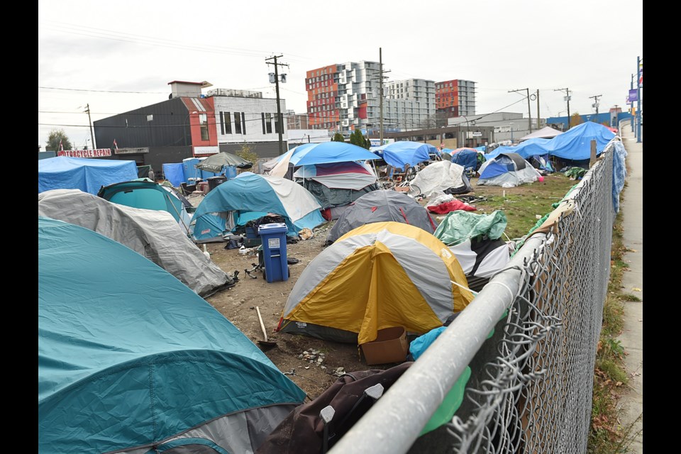 The city announced Wednesday that it wants to open temporary modular housing buildings on two city properties in the Downtown Eastside, including the current site of a homeless camp on Franklin Street. Photo Daniel Toulgoet