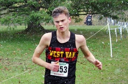 West Vancouver Secondary’s Aidan Doherty shakes off the snow on his way to a bronze medal finish at the high school provincial cross-country running championships. photo supplied Colin Dignum