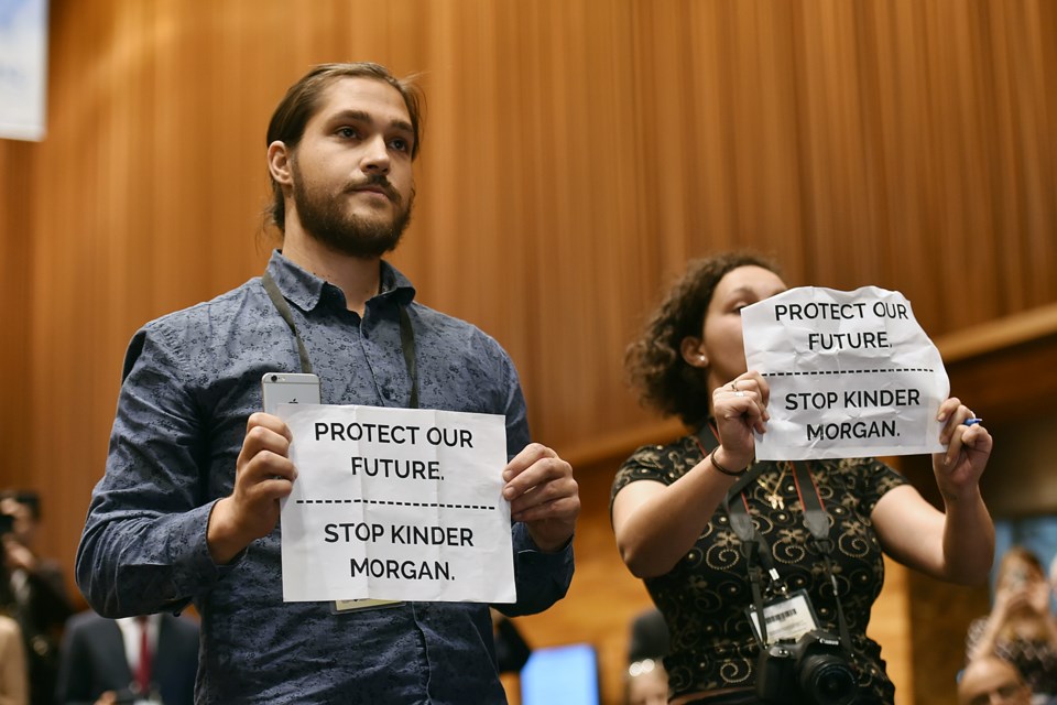 Two protesters, posing as Burnaby Now reporters, were escorted out of a press conference after questioning Prime Minister Justin Trudeau’s approval of the Kinder Morgan pipeline. Photo Dan Toulgoet