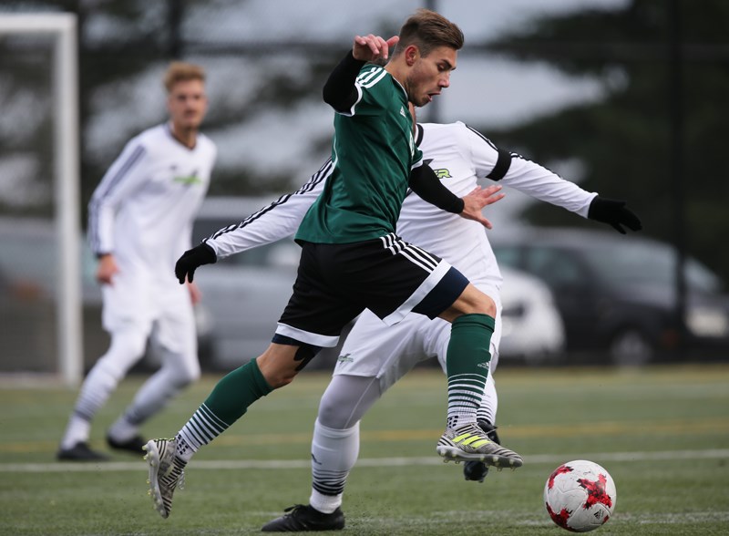 Douglas College’s Race Williams drives past an Algonquin Thunder rival during opening round action at last week’s Canadian Colleges Athletic Association national men’s soccer championship in Nanaimo.
