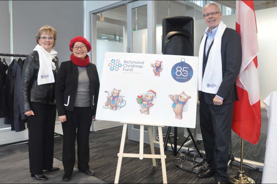 Richmond MP Alice Wong ( middle) helped the Richmond Christmas Fund launch its new mascot and logo on Wednesday. This week sees the start of various fundraising events to collect toys and cash for families in need in Richmond. Photo by Daisy Xiong/Richmond News