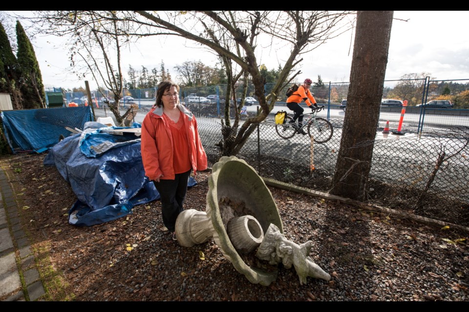 Stacey Rumsby shows the impact of night construction on realigning the Galloping Goose trail &Ntilde; part of the McKenzie Interchange project &Ntilde;right beside her house on Saanich's Grange Road.