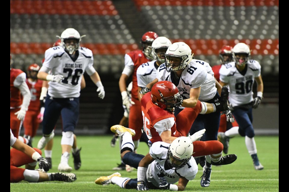 St. Thomas More’s Joel Pielak, above centre, capped the team’s first possession with a 33-yard touchdown.