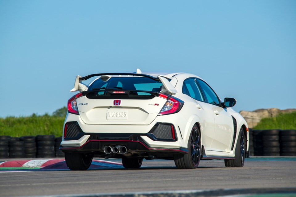 The Type R's giant rear spoiler creates downforce &Ntilde; and draws stares.