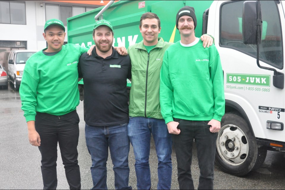 505 Junk, founded by Barry Hartman (second right) and Scott Foran (second left) in 2011, had its first two franchises open recently in the Fraser Valley and Tri City area. The two and staff Jose Cruz (left) and Alex Elsey are pictured in front of their specially designed delivery truck, which can measure the exact weight of the waste. Photo by Daisy Xiong/Richmond News