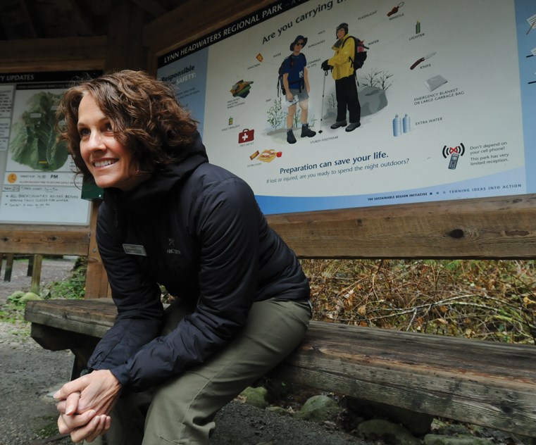 AdventureSmart provincial co-ordinator and executive director Sandra Riches sits at the Lynn Headwaters Regional Park trailhead. Riches has made it her life’s mission to educate the public about outdoor preparation in the hopes of reducing the number and severity of calls to teams like North Shore Rescue. photo Mike Wakefield, North Shore News