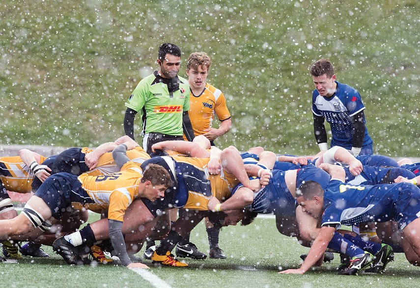 Players from UVic and UBC get pushy during the first ever Canadian University Men’s Rugby Championship final played Nov. 19 at the University of Guelph. UBC claimed the historic victory with a roster featuring eight players from the North Shore. photo Karyn Stepien