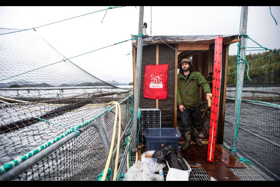 An occupier at the Marine Harvest salmon farm off Midsummer Island, near Alert Bay.