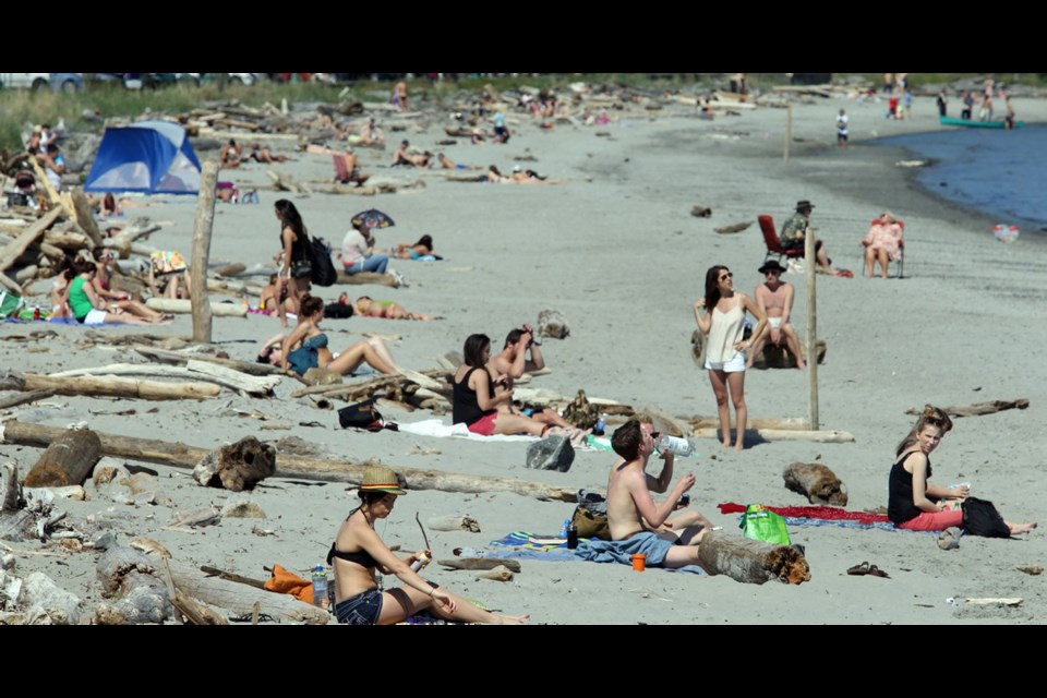 Sun worshippers crowd the sand at popular Willows Beach in Oak Bay, named best beach in the Times Colonist readers&Iacute; poll.