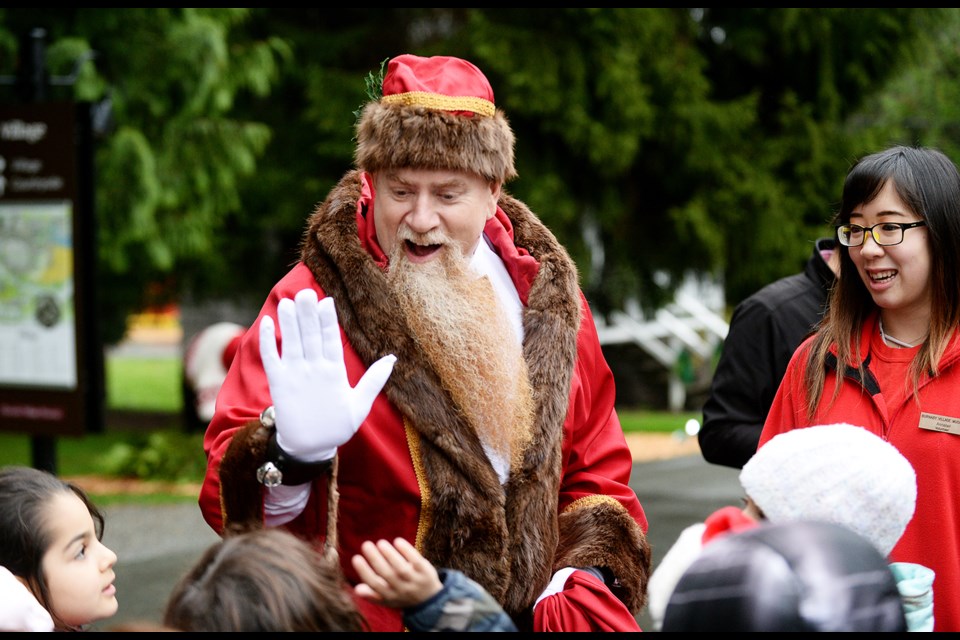 Father Christmas greets young fans.