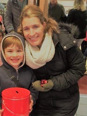 Sarah Winny, CSA Board member and son accepting donations at the door.