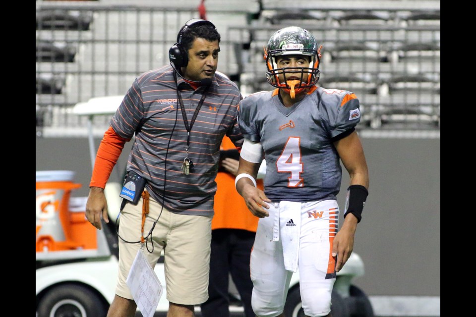 New Westminster Hyacks coach Farhan Lalji sends quarterback Kinsale Philip in with the two-point conversion play that would win the team its first BC Secondary Schools Football Association Subway Bowl championship.