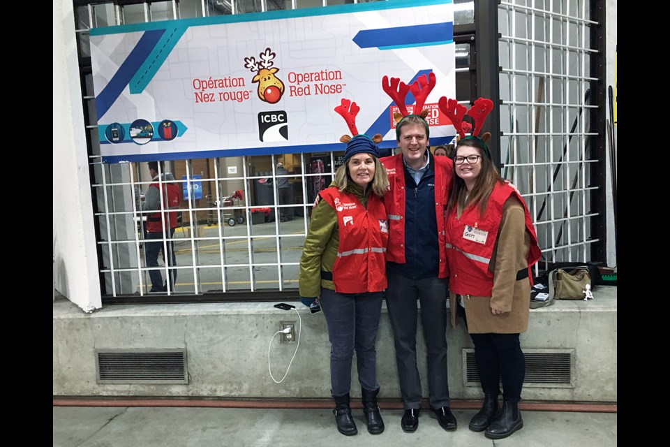 From left, ICBC road safety rep Karon Trenaman, New Westminster Mayor Jonathan Cote and New West Record reporter Cayley Dobie. The three spent Friday night volunteering for Operation Red Nose.
