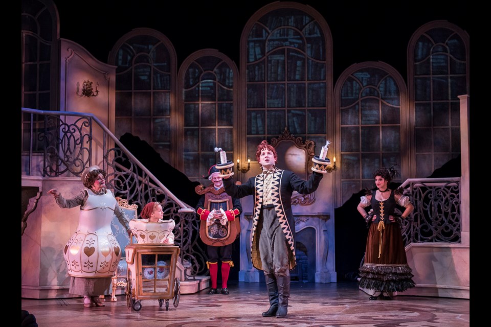 Peter Jorgensen as Lumiere (foreground) in the Arts Club's Beauty and the Beast. He's seen with Susan Anderson, Nolen Duboc, Shawn Macdonald and Anna Kuman. Set design by Alison Green, costume design by Barbara Clayden, and lighting design by Gerald King.
