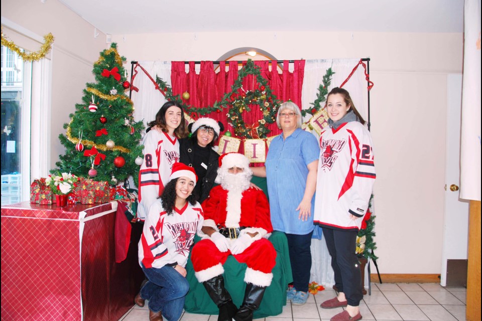 The Richmond Devils Senior AA Women’s team once again participated in the Santa Breakfast at Richmond Family Place. This year, Santa was none other than coach Tony Cheema along with some elves from the team (Brynley Ross, Natalie Korenic & Kaarina Swinburnson). Earlier in the week, other players set up and decorated the venue to welcome many new families to Richmond. Photo submitted