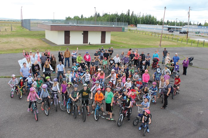 Kids and parents gathered in front of Blackburn Community Centre to show their support for the RE/MAX Adventure Park, an all-wheels park that will be built next summer at the site, giving the area east of the airport a place for kids of all ages to ride their skateboards, scooters and bikes. The $150,000 project, backed by donations from realtors at RE/MAX Centre City Realty, local businessman Jordy Hoover and the Yellowhead Rotary Club, will be built in two phases, to be completed in the summer of 2019.