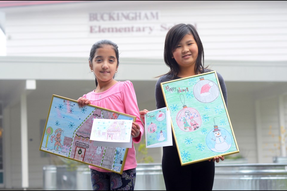 Buckingham Elementary students Arneet Butter and Cynthia Low were recognized at a recent city council meeting after their art was chosen to adorn Christmas cards sent out by the City of Burnaby this year.