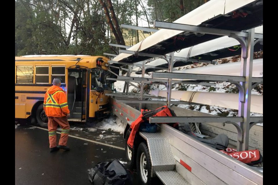 A truck and boat trailer used for the Canadian Olympic men's rowing team collided with a school bus near Shawnigan Lake School on Friday.