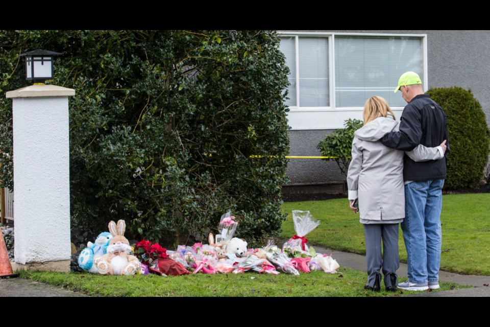 A growing collection of stuffed animals and floral tributes has been left on the lawn outside Haro Apartments in Oak Bay, where the bodies of two young sisters were discovered by police in their father's apartment on Christmas Day.