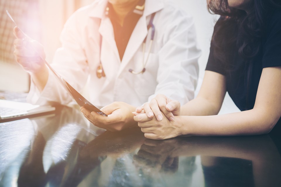 woman talking with doctor