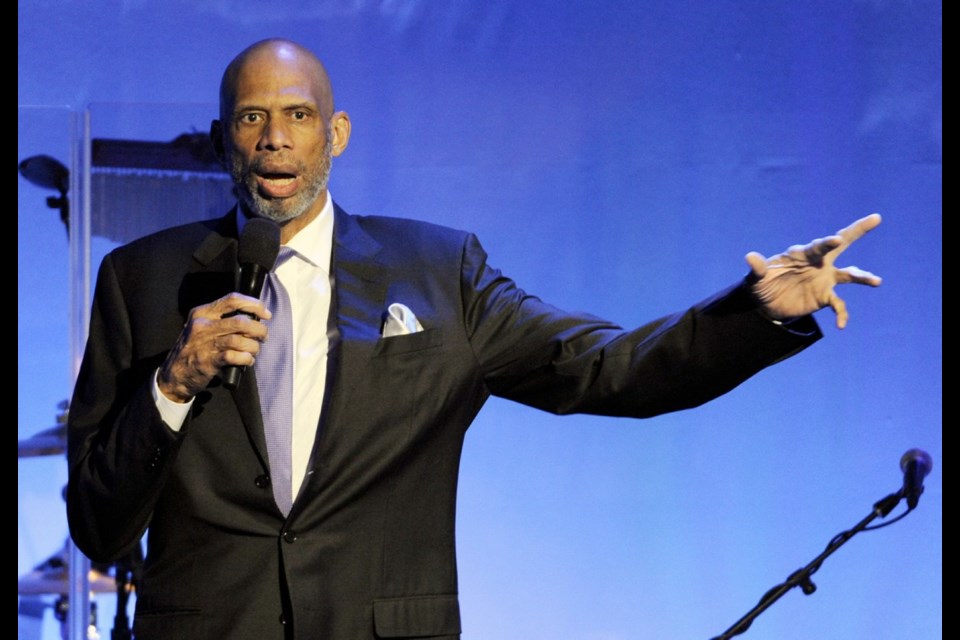 Kareem Abdul-Jabbar addresses a Los Angeles audience in 2014. In his new book, the basketball legend writes about his early experiences with racism and how they fuelled his embrace of Islam.