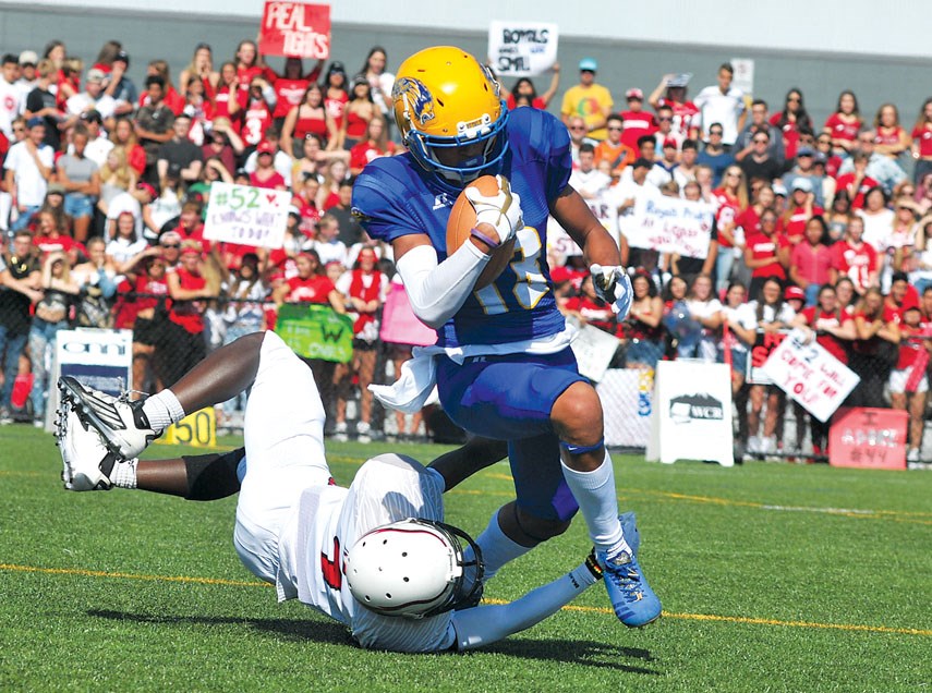 Handsworth’s Keelan White makes a play against Carson Graham in Buchanan Bowl 31 played in September. The Grade 11 receiver was one of the top playmaker’s in the province this season and has earned a spot on Team Canada for an upcoming all-star game against the United States. photo Paul McGrath, North Shore News