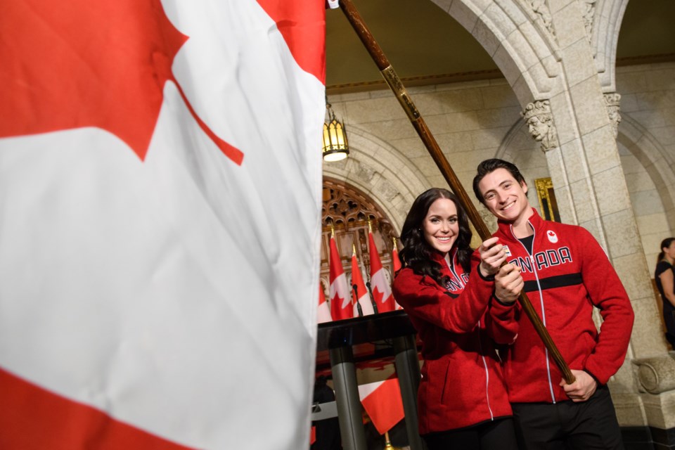 Figure skaters Tessa Virtue and Scott Moir were announced as Canada’s flag bearers for the opening c