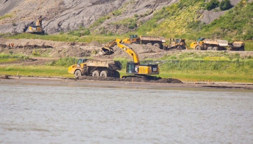 Crews carry out Site C construction work on the north bank of the Peace River in 2017.
