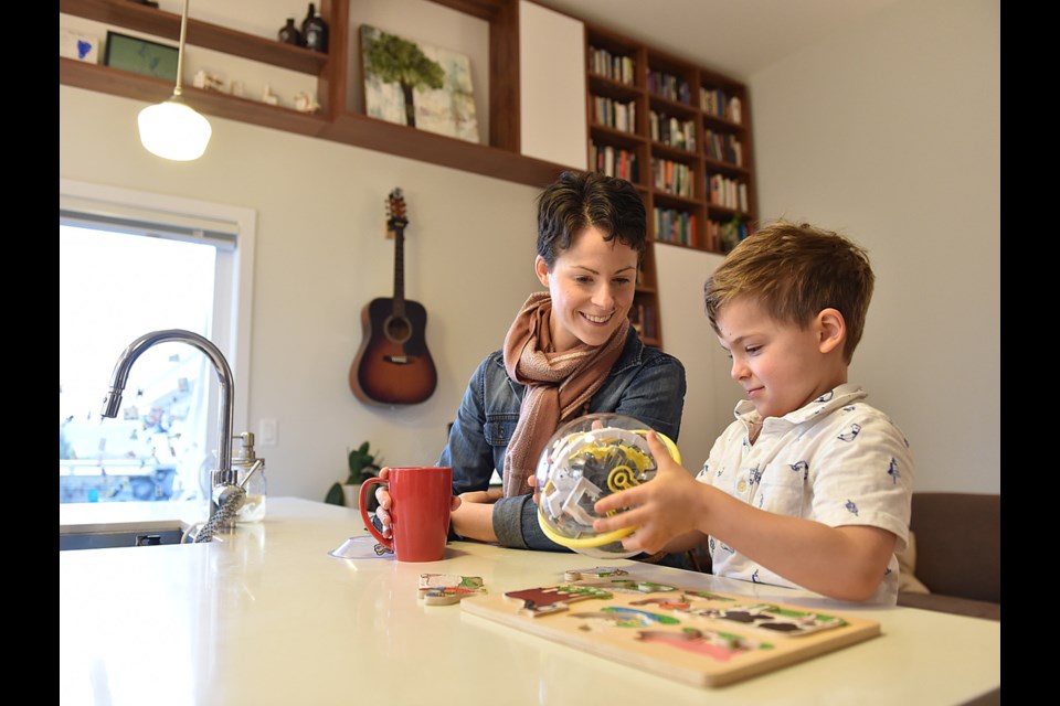 Ericka Stephens-Rennie and her son Jacob, four, spend time together in their unit in the Vancouver Cohousing complex in East Van. Photo Dan Toulgoet