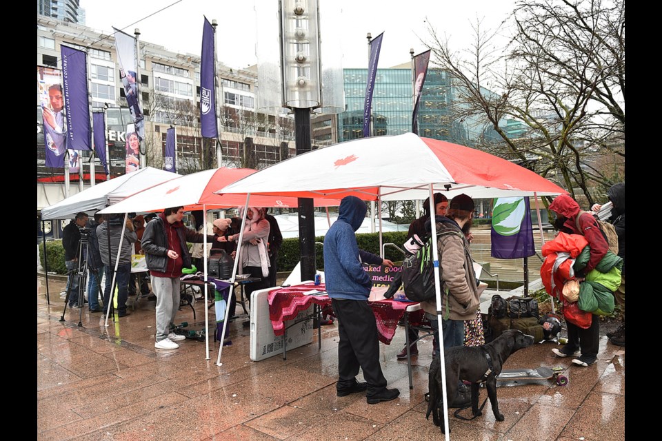 Several marijuana vendors returned to Robson Square Tuesday afternoon despite police arresting four people in the previous 48 hours. Photo Dan Toulgoet