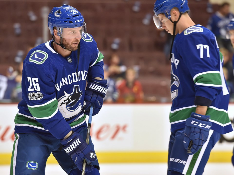 Thomas Vanek warms up alongside Nikolay Goldobin.