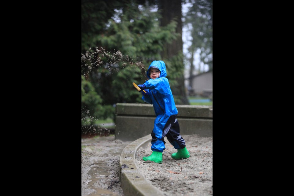 You too can embrace the rain: All you need's a rain suit, some rubber boots, a shovel and a can-do-it attitude. Four-and-a-half-year-old Nolan Bennie found a useful way to occupy himself on a soggy Sunday - digging trenches in the playground at Queen's Park.