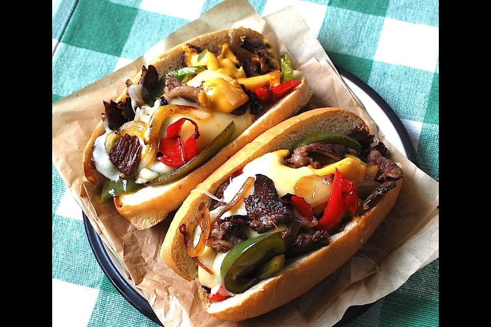 Philly Cheesesteak, served in a bun, is a filling combination of succulent beef, onions, peppers and melted cheese.