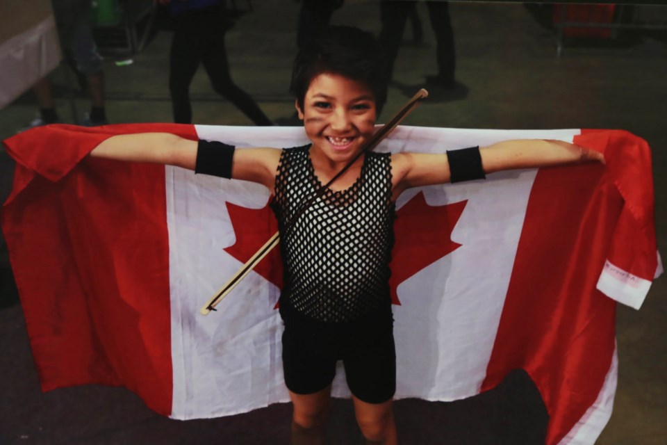 Anthony Juo proudly sports his Canadian colours after winning a bronze medal at the IDO World Show Dance Championships.