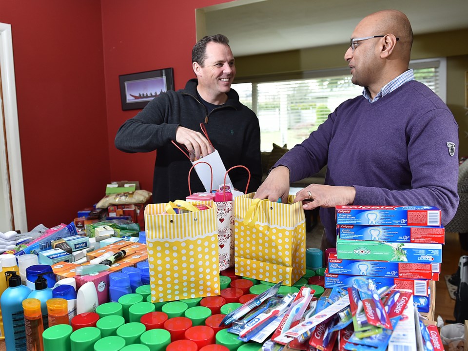 Paul Williams, a pastor at Granville Chapel, and Nizar Assanie are among Marpole residents who colle