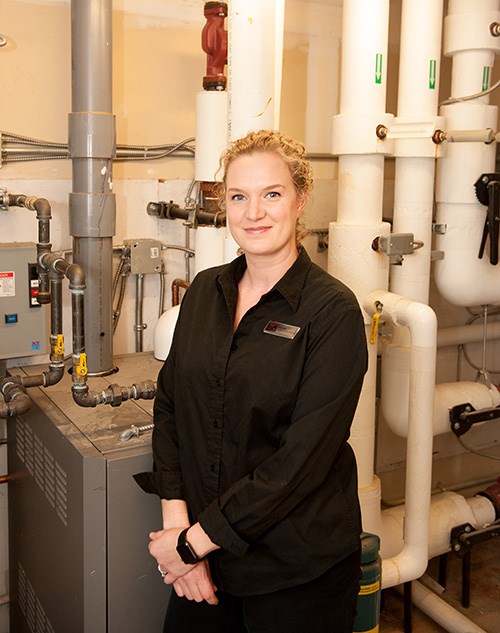 Westcoast Railway Heritage Park conference services supervisor Ashlie Metcalf with the building's GeoThermal system.