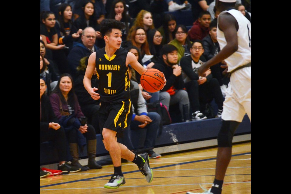 Burnaby South Rebels' Kyle Kirmaci looks for an open play during recent league action. The Rebels advanced to the 4-A Lower Mainland semifinal with a polished 80-54 victory over Killarney.