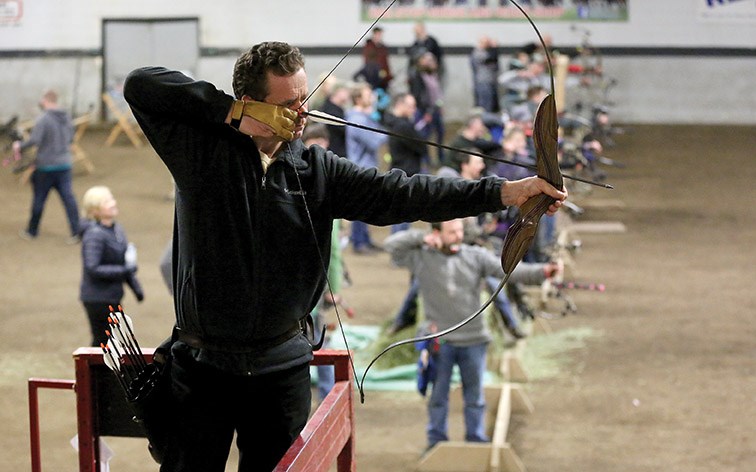 Dan Mobbs of Williams Lake eyes up his target at the Agriplex on Saturday afternoon as he competes in the Silvertip Archers Indoor 3-D Tournament. Citizen Photo by James Doyle