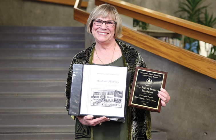 Tiiu Noukas, Co-chair of the Heritage Committee for the Prince George Retired Teachers' Association poses for a photo with a 2018 Jeanne Clarke Memorial Local History Publication Award, and Historical Memories, the four-part series that features all 138 former and current SD57 schools on Sunday evening at the Jeanne Clarke Memorial Local History Award ceremonies that were held at Prince George Public Library. Noukas co-edited the book with Kris Nellis, also a Co-chair of the Heritage Committee for the Prince George Retired Teachers' Association. Citizen Photo by James Doyle