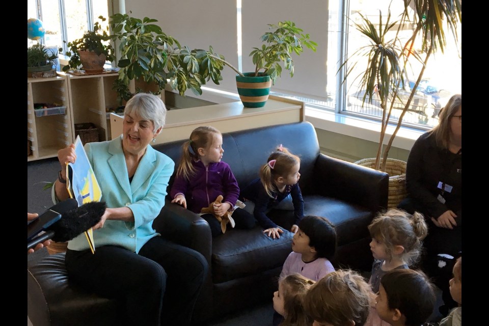 Finance Minister Carole James reads Pete the Cat to youngsters at the YMCA-YWCA Victoria on Broughton Street this morning.