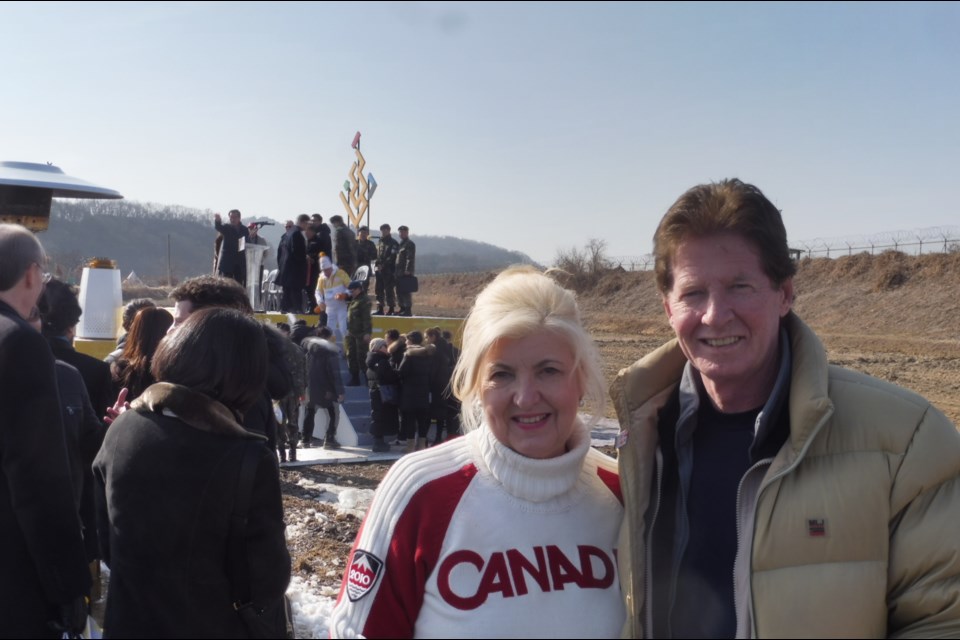 Karen Baker-MacGrotty and David MacGrotty attended Day 80 of the Torch Relay in Paju, prior to the opening of the 2018 Winter Olympics. The ). While attending the relay, they were able to see the mountains of North Korea just a few miles away and barbed wire fencing all along the border.