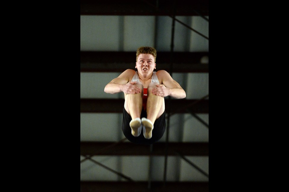 Byrne Creek Secondary's Declan McLean tucks in during his individual trampoline event at last week's Aaron Johnson Memorial Cup.