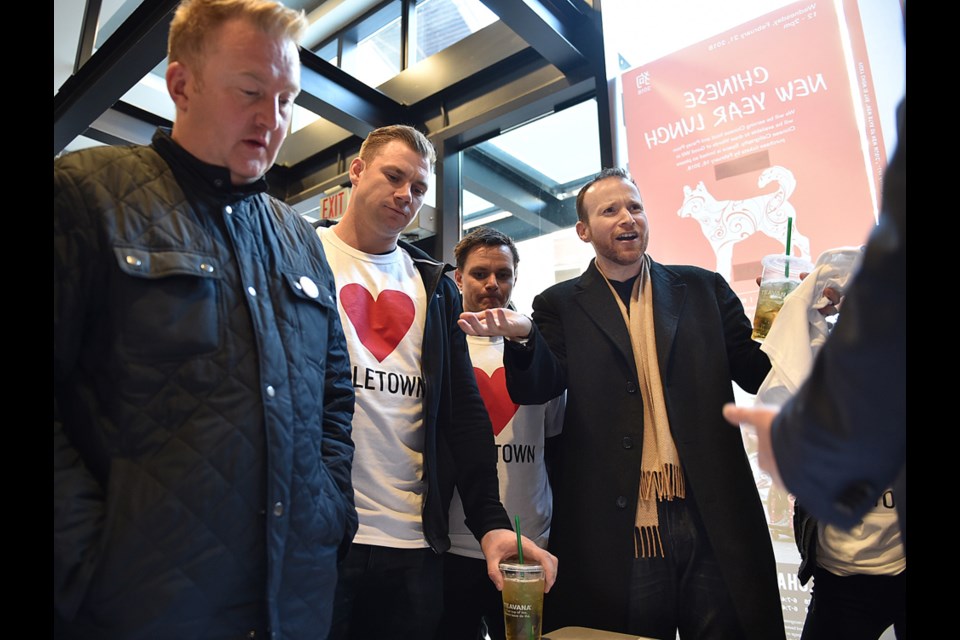 Andrew Pollard, right, attended the City of Vancouver open house about the changes to parking on Hamilton and Mainland streets in Yaletown.