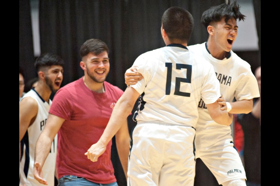 A fired up RC Palmer team celebrate its big win over St. Pat's at the Lower Mainland 2A Championships to clinch a spot in the upcoming provincial tournament at the Langley Events Centre.