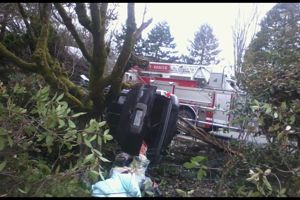 A vehicle flipped on its side Tuesday morning and crashed into the garden of the 106-year-old property on Jones Road, near the intersection of No. 3 and Blundell roads. Sam Lackner photo
