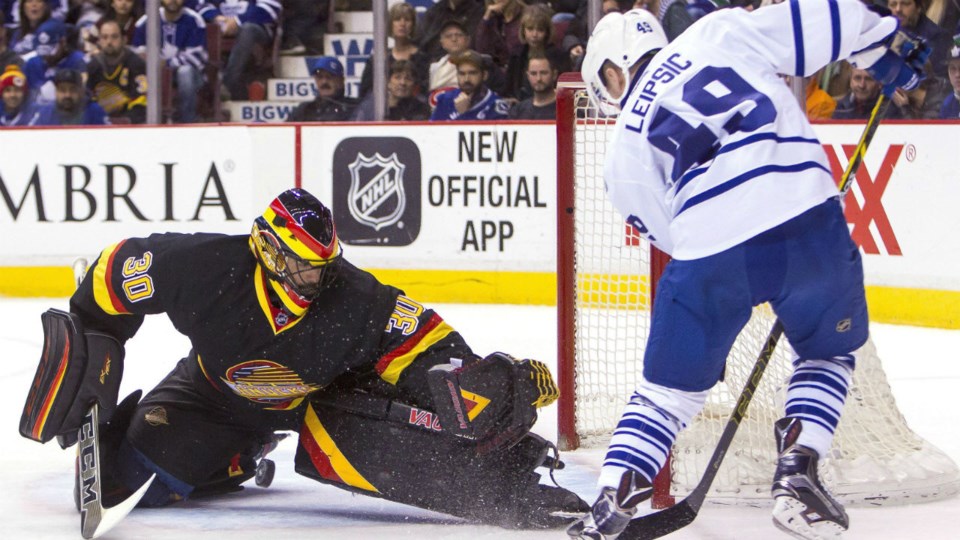 Brendan Leipsic scores on Ryan Miller of the Vancouver Canucks