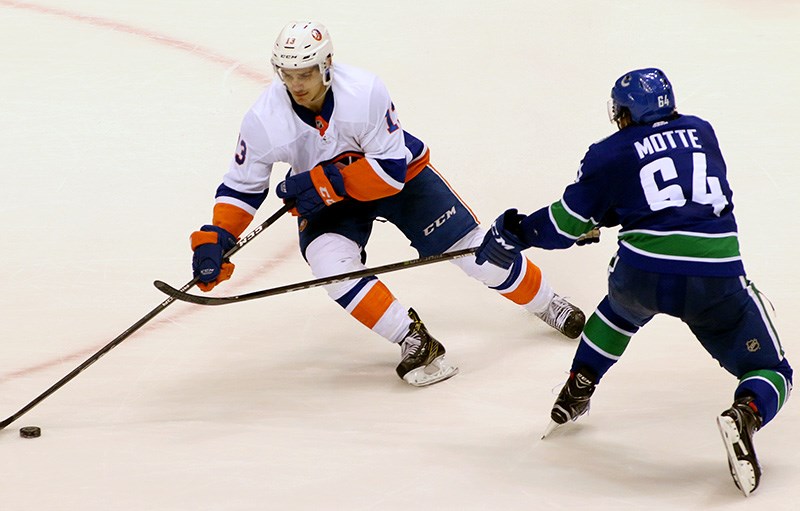 April 14, 2019: New York Islanders center Mathew Barzal (13) skates the  puck during the third period of play in the NHL Hockey playoffs game 3,  round 1 between the New York