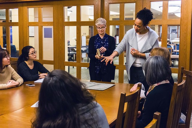 Chelsea Shriver and Anne Lama discussing the restoration process of the Elizabeth Barret Browning po