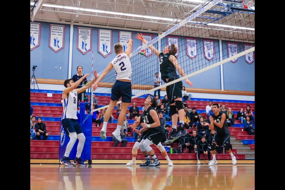 Capilano Blues setter Simon Friesen smashes a quick-hit kill during a PacWest matchup. This week Friesen was named the CCAA national player of the year. photo Paul Yates/Vancouver Sports Pictures