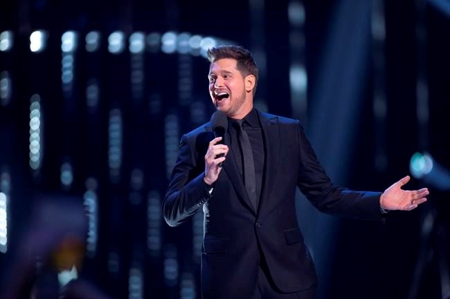 Host Michael Buble is shown on stage at the Juno Awards in Vancouver, Sunday, March, 25, 2018. It was a night of positivity at the Juno Awards as the stars of Canadian music focused on celebrating the upsides of life. THE CANADIAN PRESS/Darryl Dyck